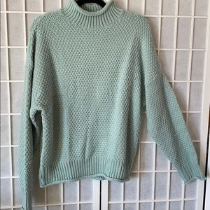 Turquoise turtleneck sweater